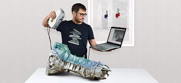 Man 3d scanning an engine with artec studio software